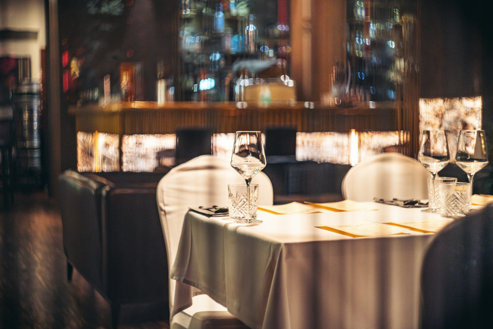 Vintage moody restaurant dining room with warm lighting
